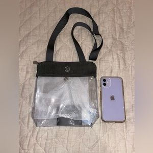 Baggallini clear bag with dark grey adjustable straps